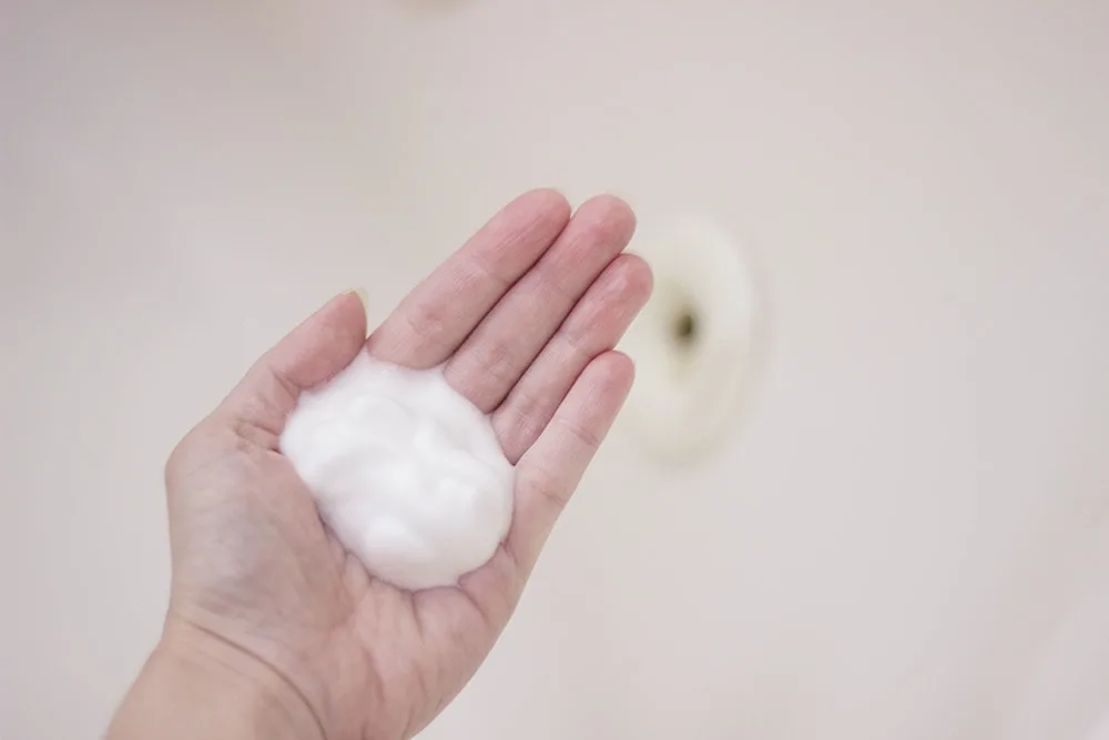 Dove shower foam in my hand.