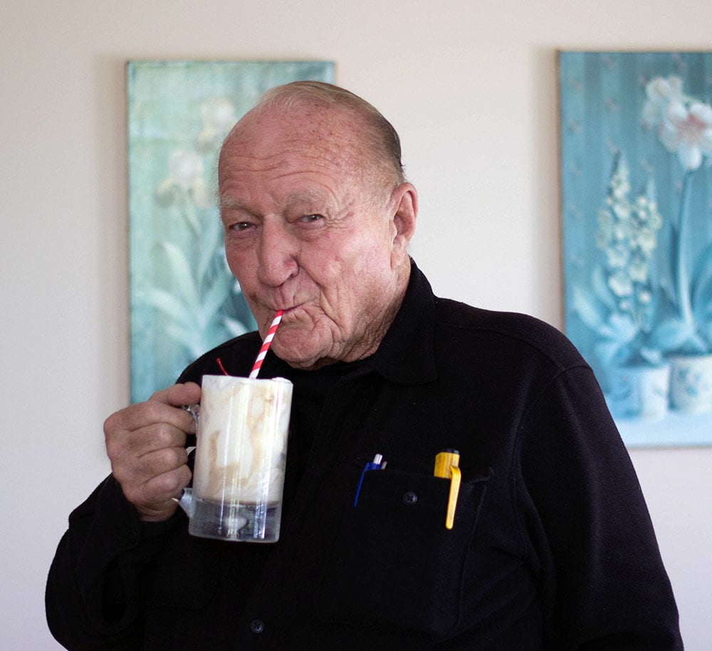 Donald VanWitzenburg drinking a root beer float.