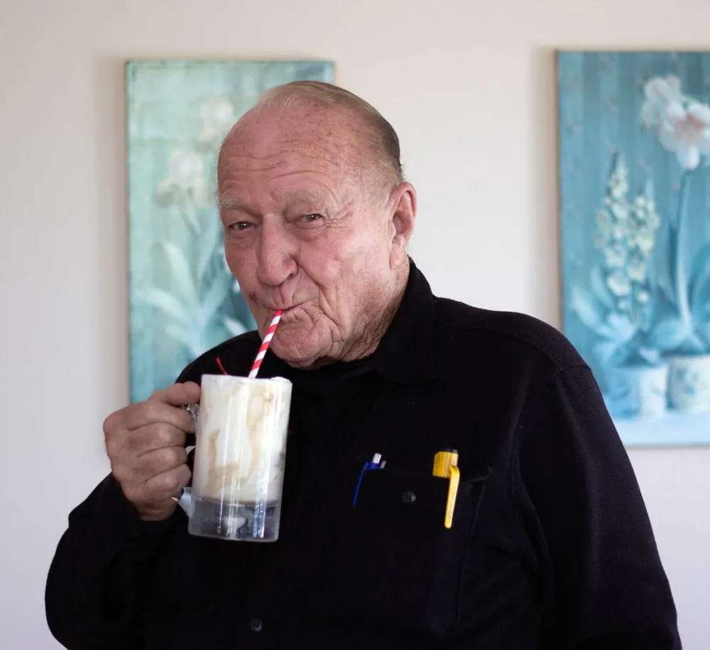 Donald VanWitzenburg drinking a root beer float. 