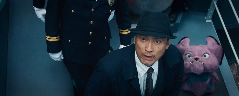 KEN WATANABE as Lieutenant Hide Yoshida and Snubbull in Legendary Pictures' and Warner Bros. Pictures' comedy adventure "POKÉMON DETECTIVE PIKACHU," a Warner Bros. Pictures release.
