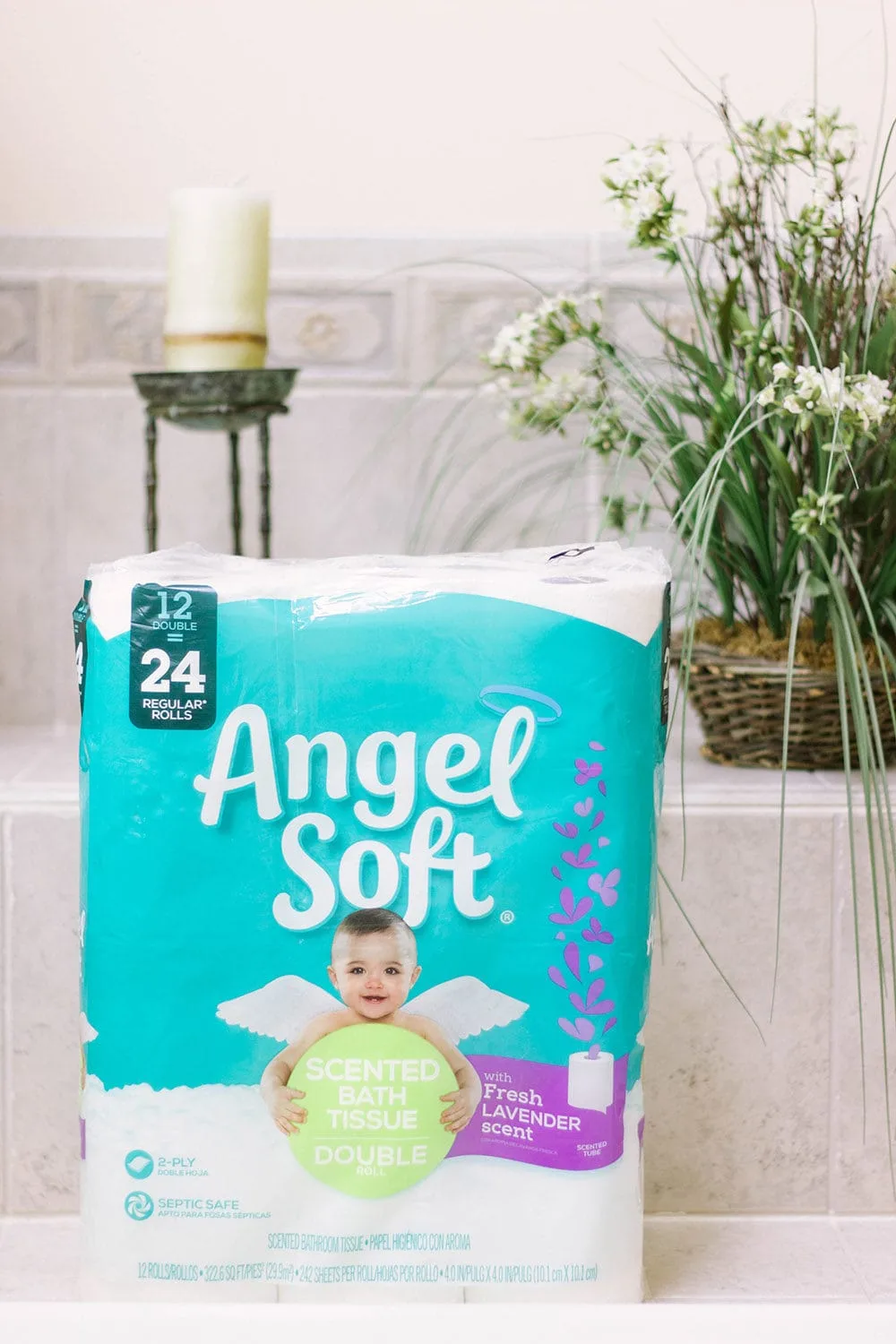 Angel Soft toilet paper in a bathroom with plants. 