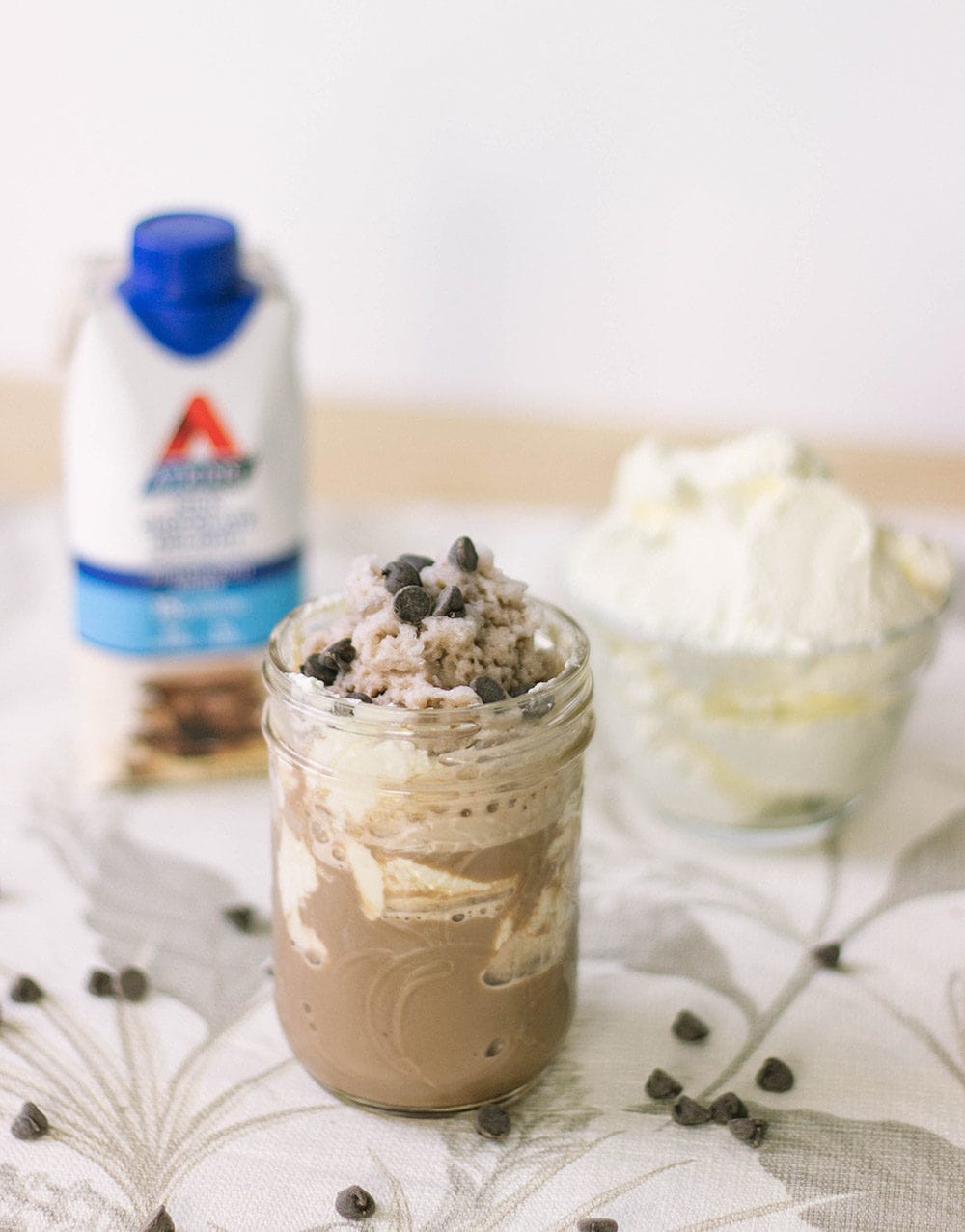 Atkins shake, whipped cream, and jar of chocolate shake