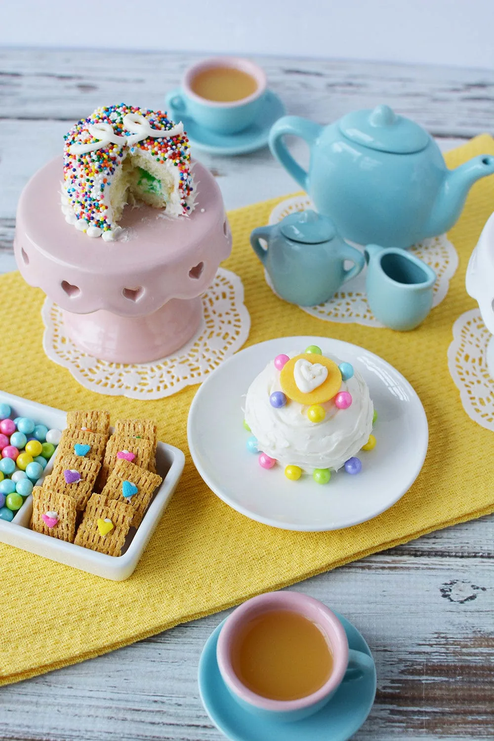 Tea party with fairy cakes and mini desserts.