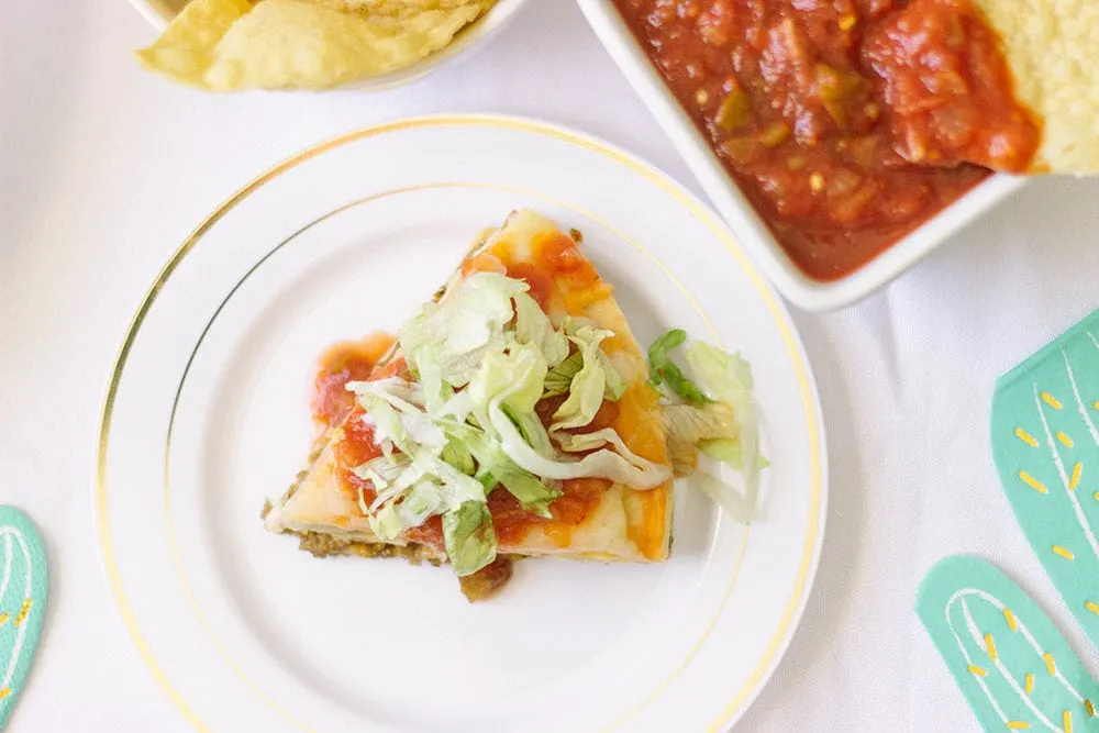 Taco pizza overhead shot on a plate. 