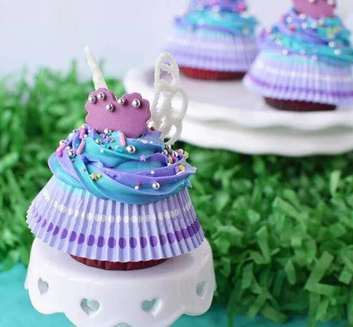 Fairy wing cupcakes on a little cake stand.