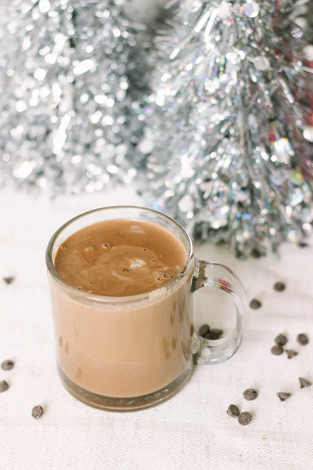 Keto hot cocoa with chips and silver trees.