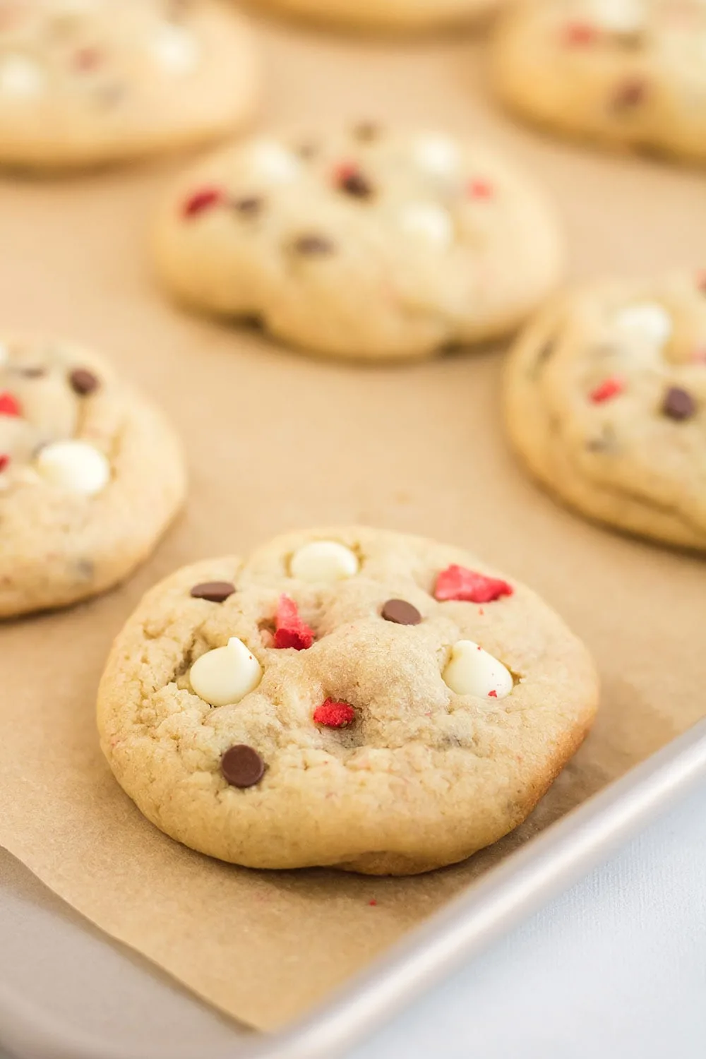Baked cookies on sheet.
