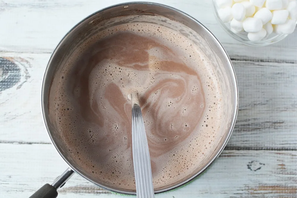 Hot chocolate in saucepan.