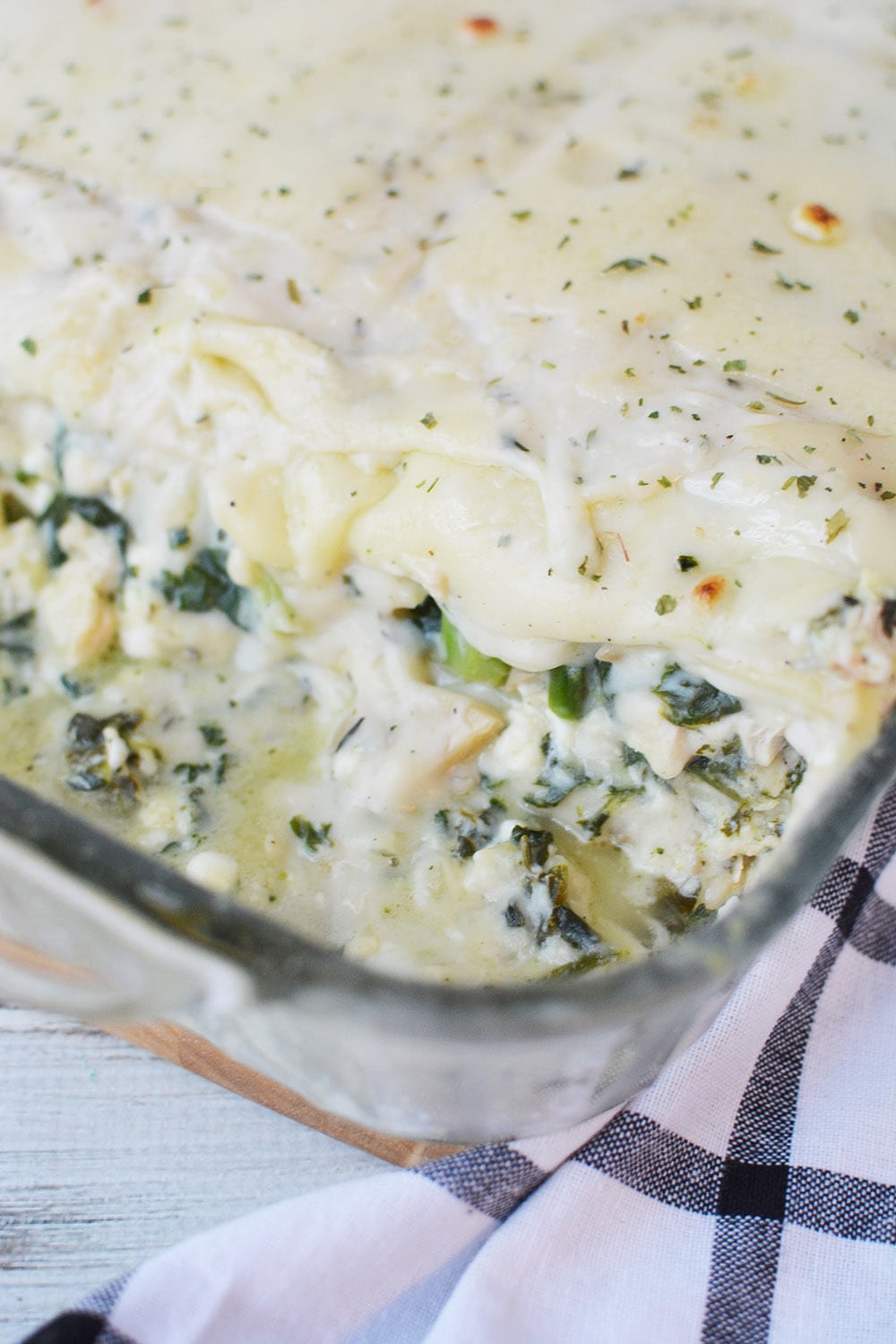 Spinach and chicken lasagna in a pan. 