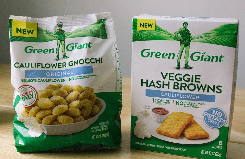 Green Giant veggie hash browns and gnocchi in bags on a desk. 