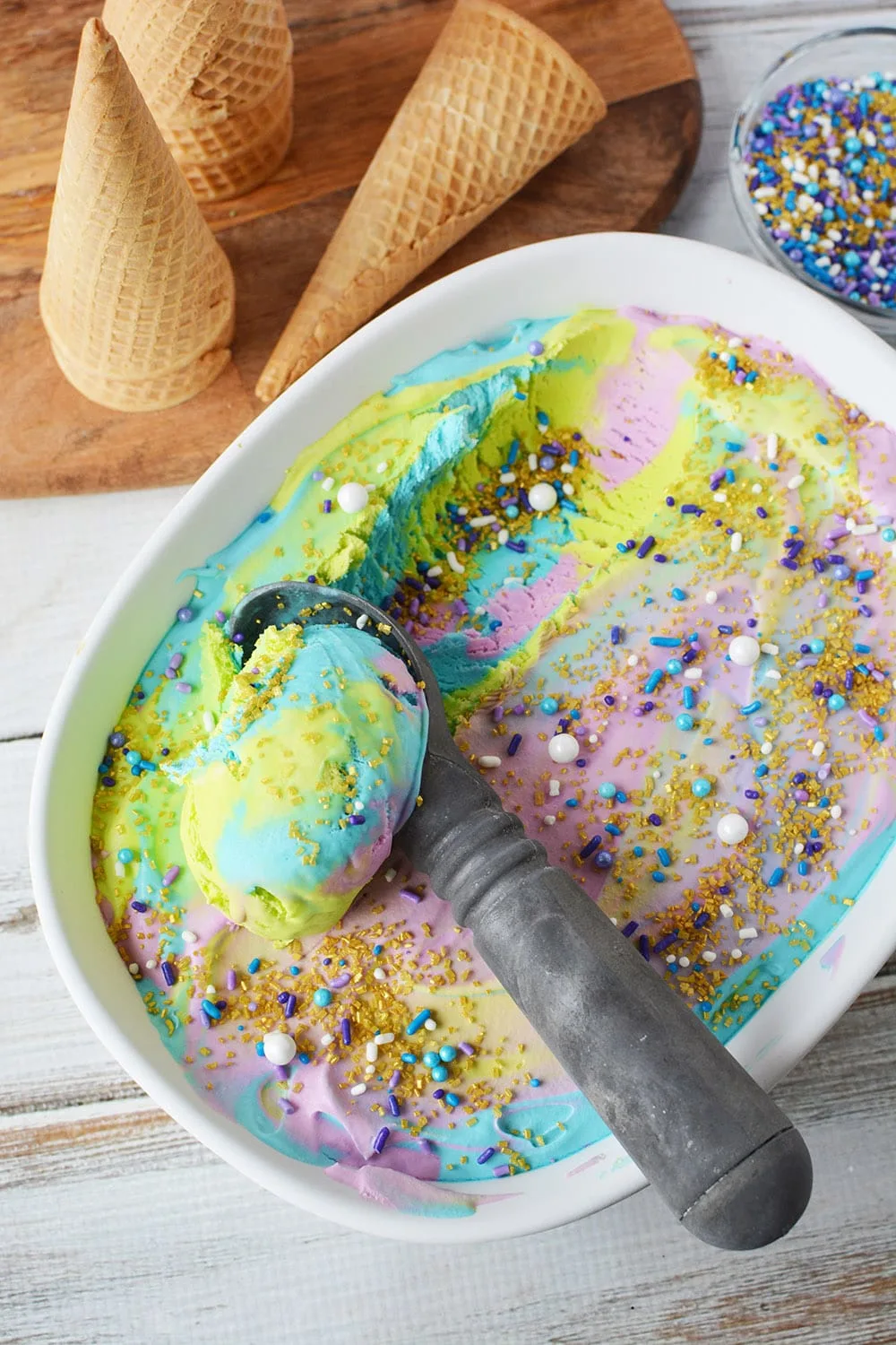 Scooping mermaid ice cream out of the pan.