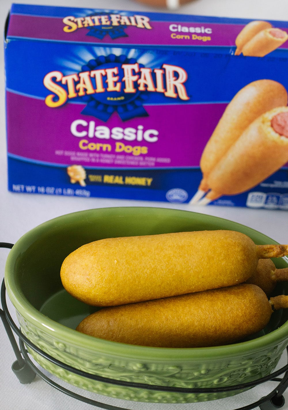 State Fair Corn dogs next to the box. 