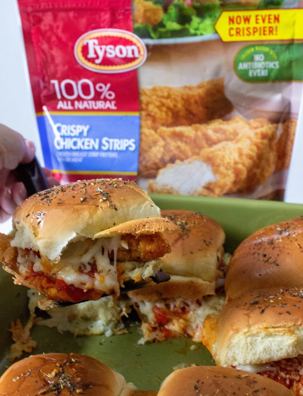 Chick parm sliders next to the bag of Tyson crispy chicken strips. 