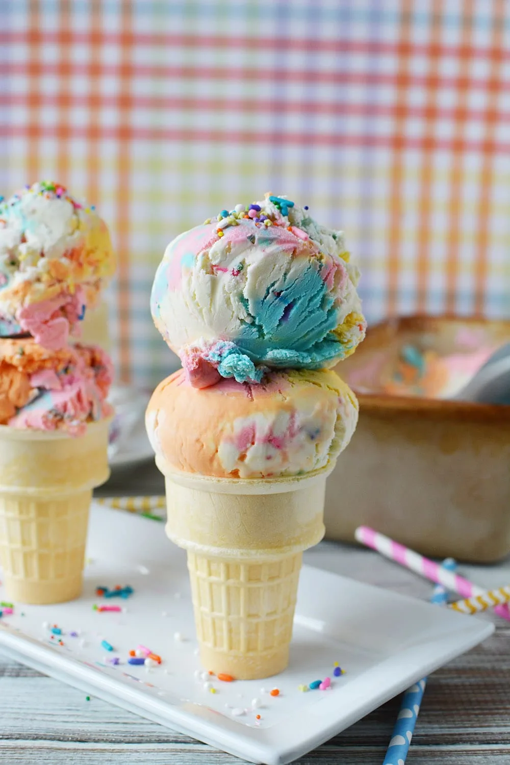 Ice cream cone with two scoops of unicorn ice cream.