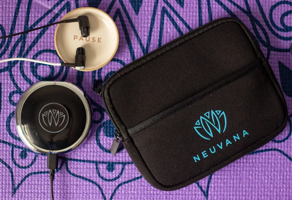 Neuvana ear buds on a yoga mat.