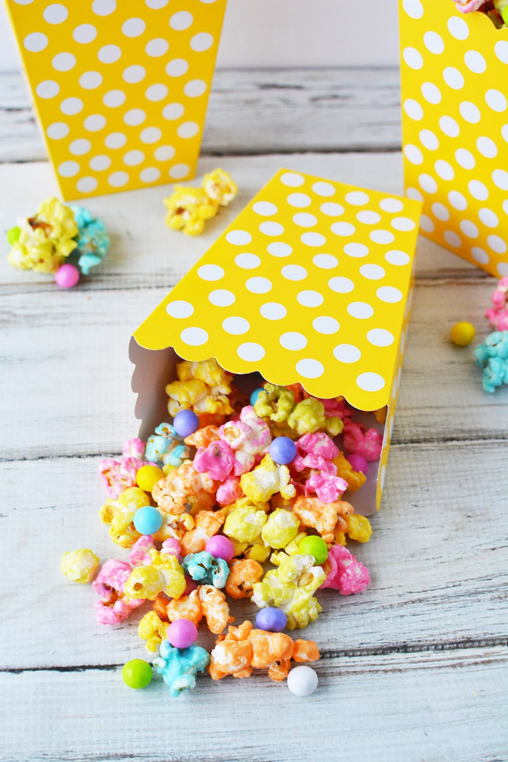 Rainbow popcorn mix in a yellow boxes