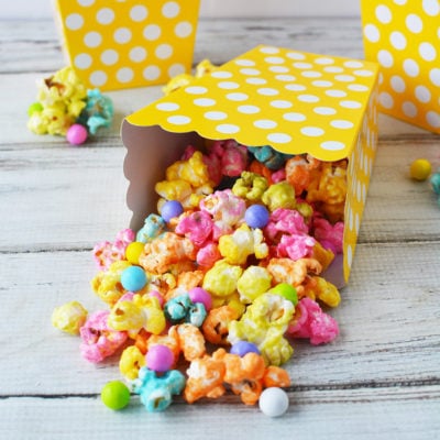 Rainbow unicorn popcorn in yellow popcorn boxes