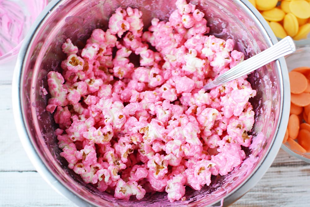Pink popcorn in a bowl.