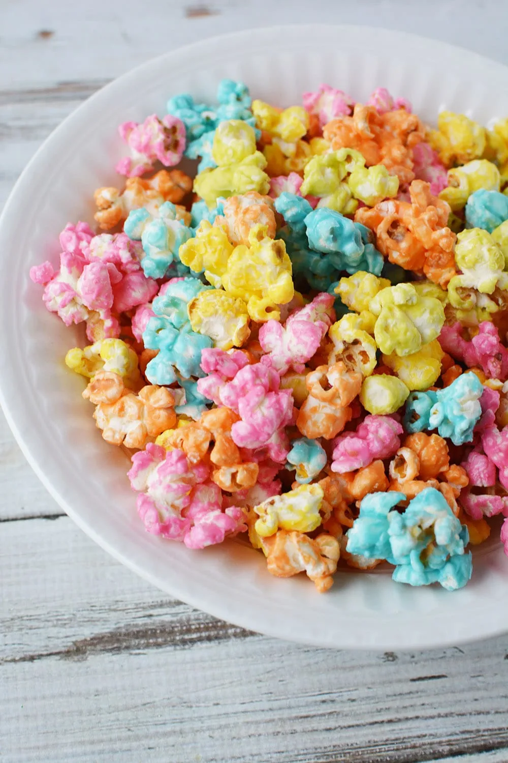 Unicorn popcorn mixed into a bowl.