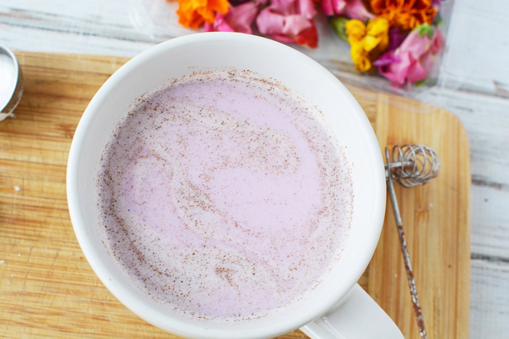 Cinnamon pink milk in a mug.