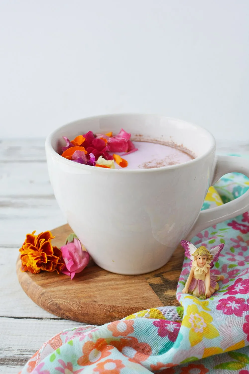 Mug full of moon milk with flowers.