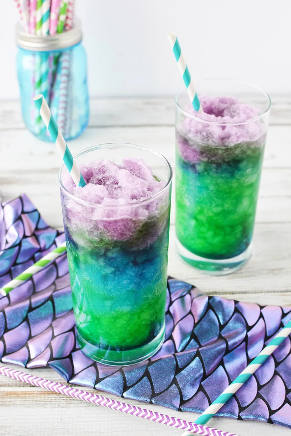 Slushies in glasses with straws.