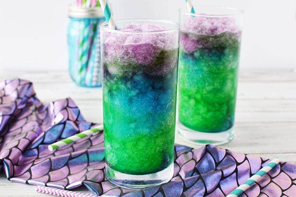 Mermaid drinks in glasses with straws. 