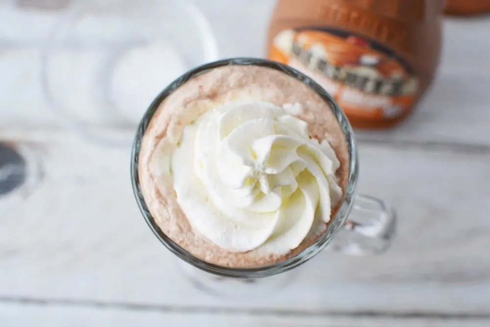 Whipped cream on coffee.