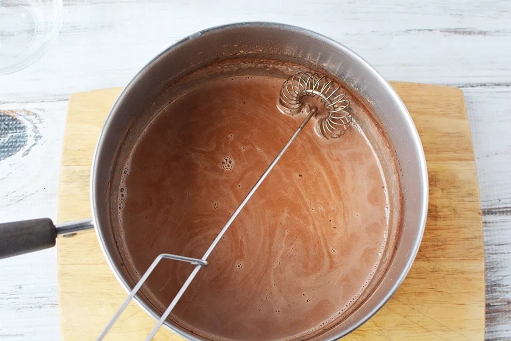 Whisk in saucepan full of cocoa mixture.
