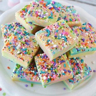 Rainbow unicorn fudge on a plate in slices