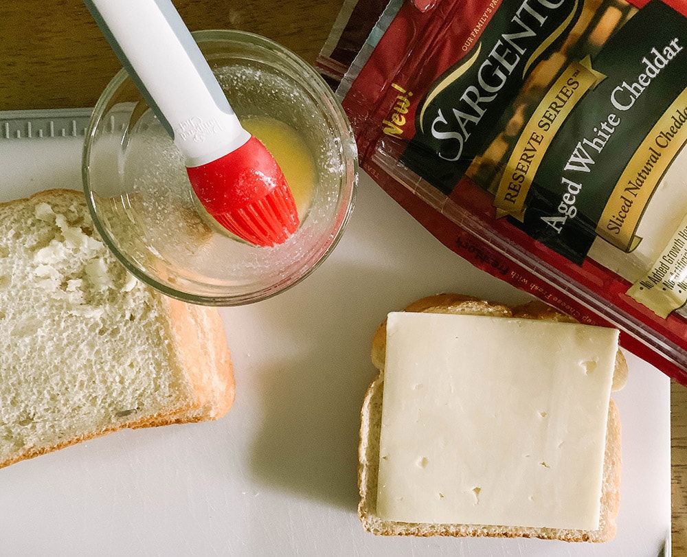 Butter on bread and a slice of cheese