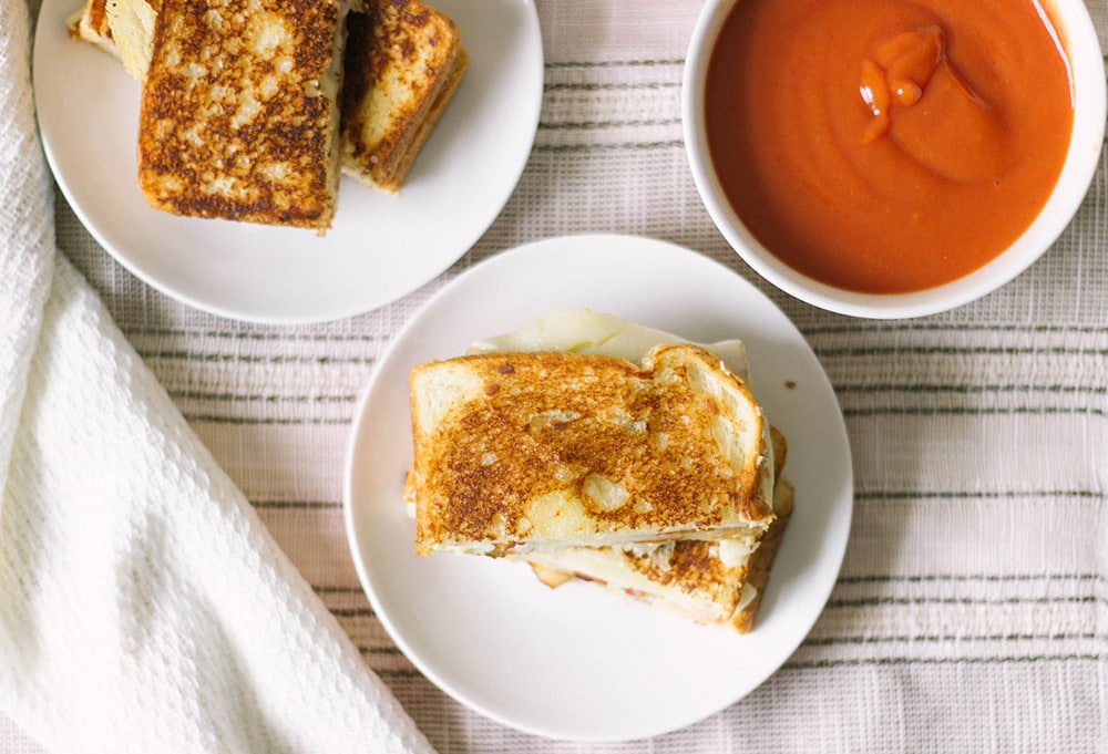 Overhead shot of grilled cheese and tomato soup