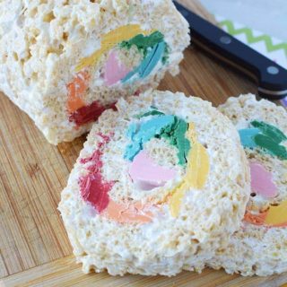 Pinwheel rainbow Rice Krispies treat on a board