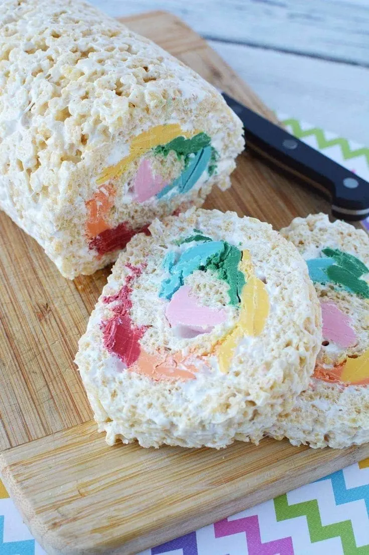 Pinwheel rainbow Rice Krispies treat on a board