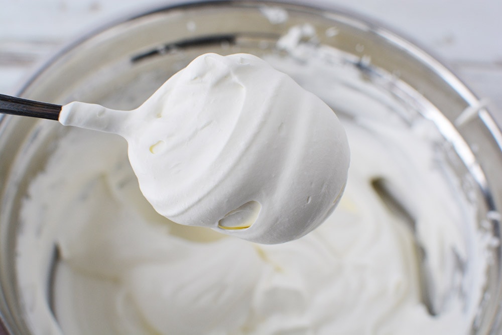 Mixing whipped cream in a mixing bowl. 