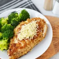 Herb crusted chicken and broccoli dinner on a plate