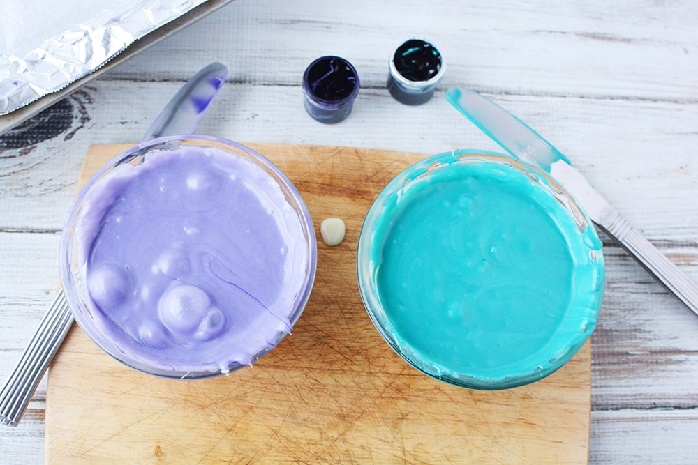 Purple and blue colored fudge in bowls.