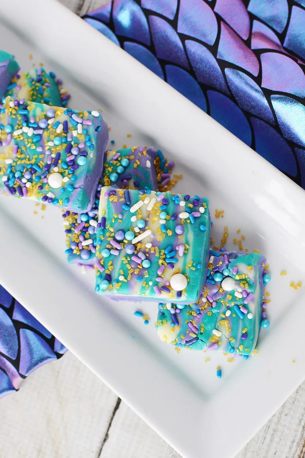 Mermaid candy fudge sliced on a serving platter.