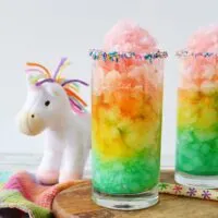 Unicorn slush in rainbow layers in glass