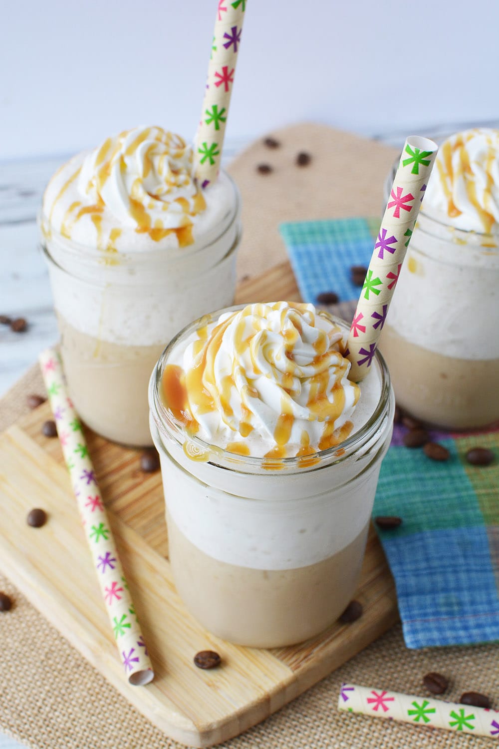 Caramel frappuccino glasses with straws. 