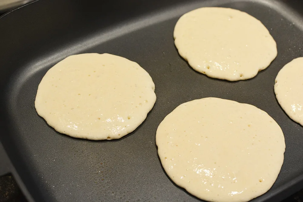 Pancakes on a hot skillet.