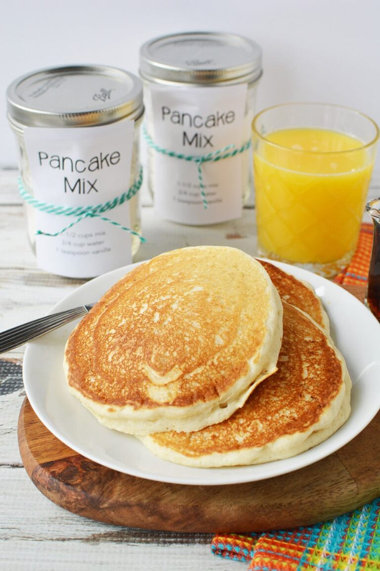 pancakes on a plate and jars and orange juice