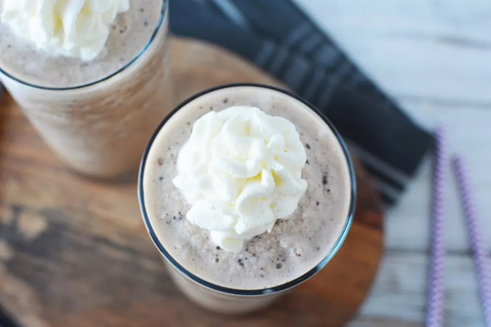 Whipped cream on top of blended frappuccino.