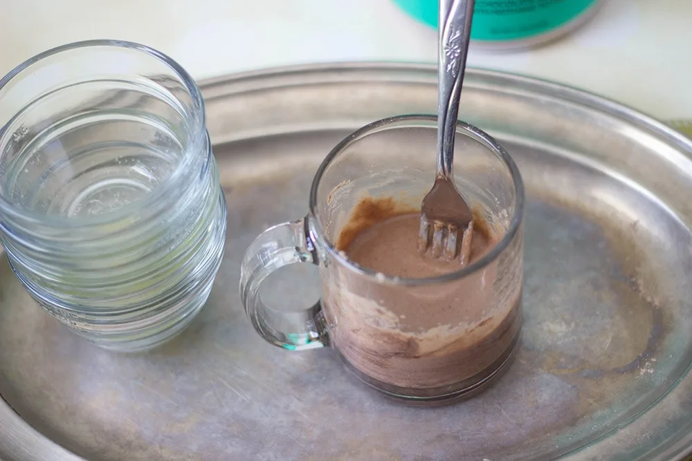 Keto mug cake batter in mug.