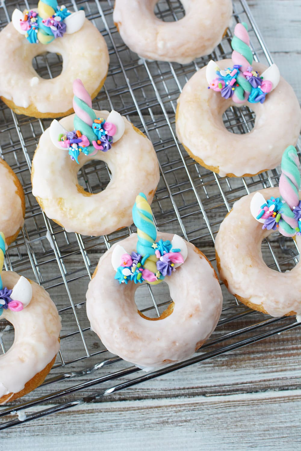 unicorn donuts on a cooling rack