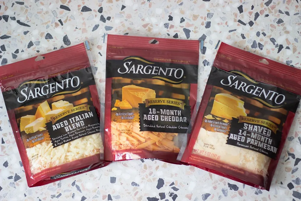 Packages of shredded cheese.