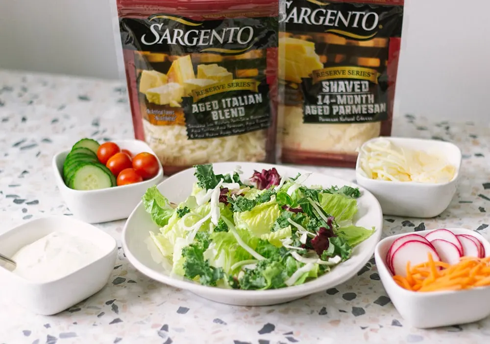 Salad with bowls of topping choices.