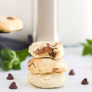 cookies stacked in front of air fryer