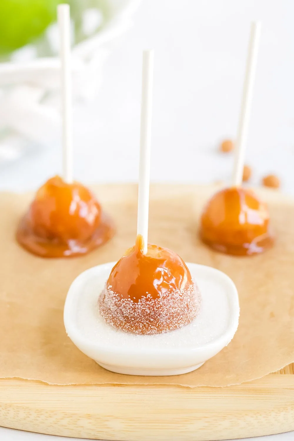 Sugar topping on a mini candy apple.