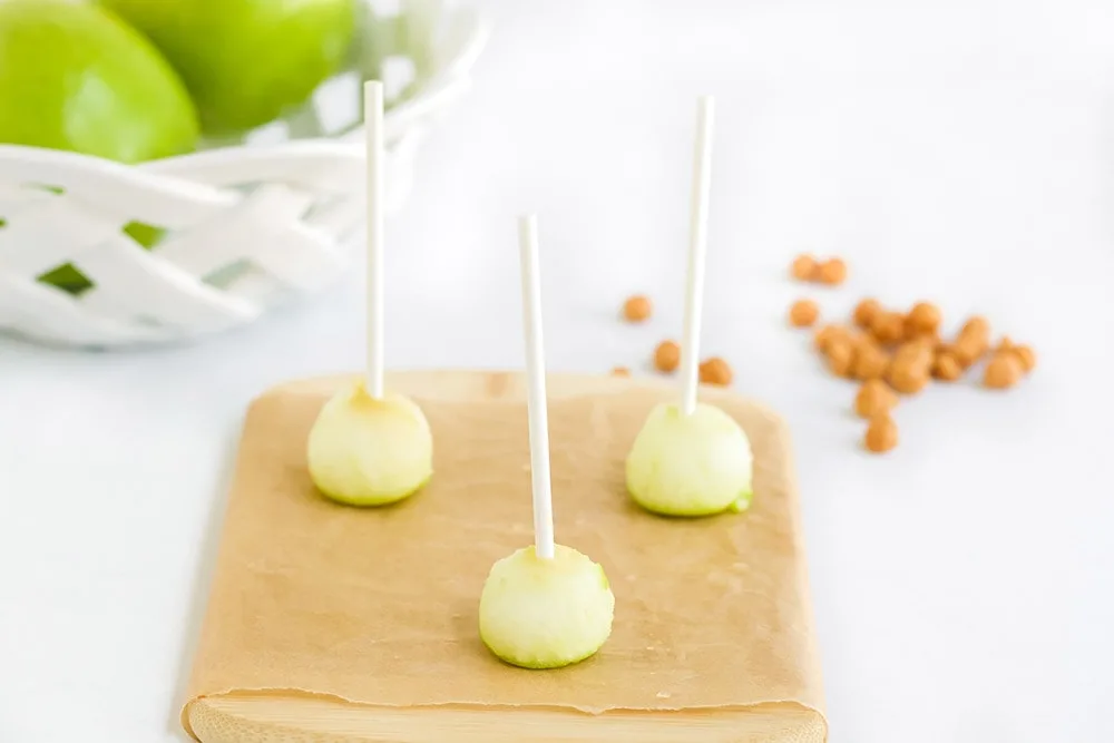 Sticks in apple balls.